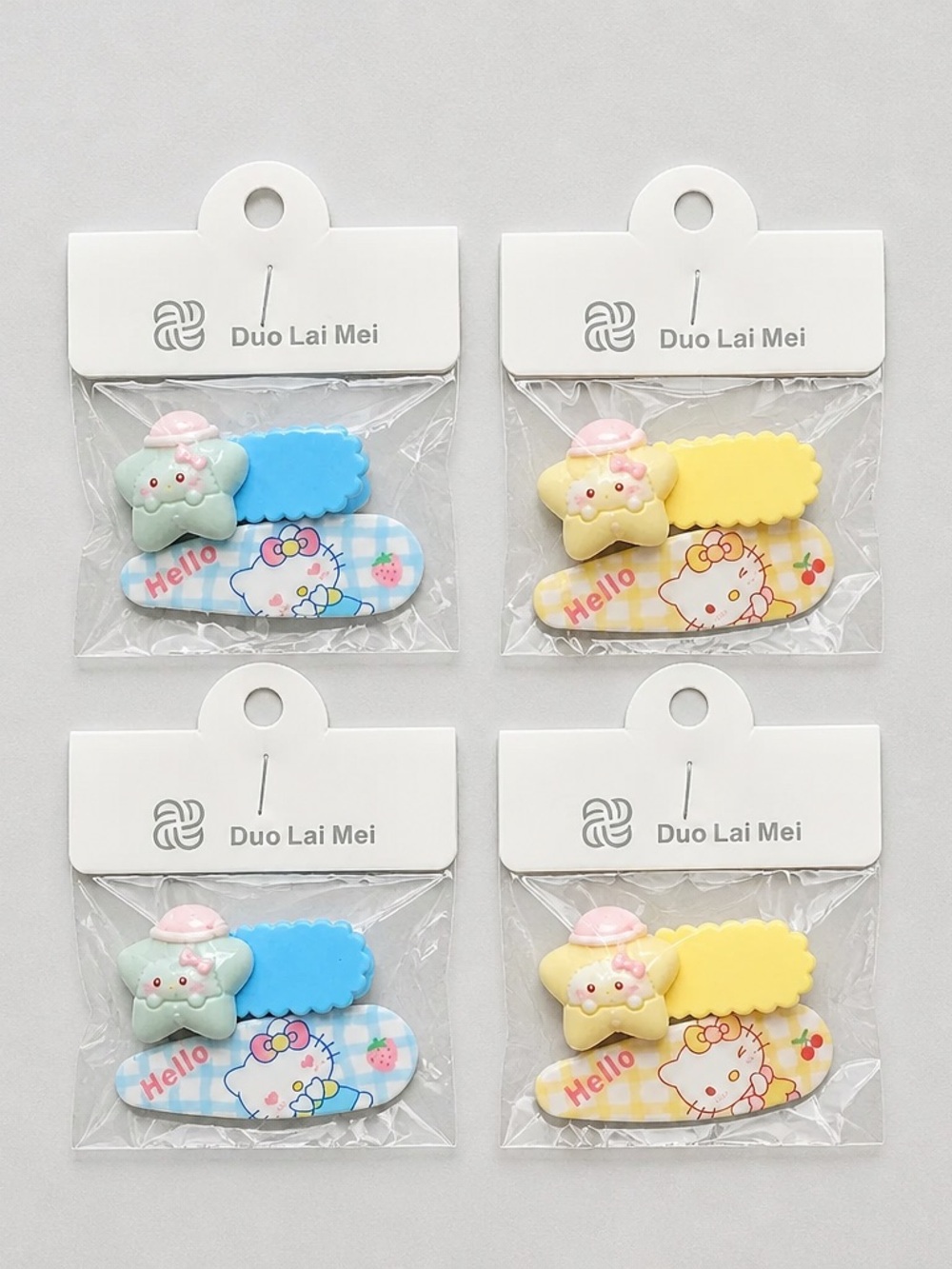 NWT Set of 4 Hello Kitty Child Size Hair Clips Barretts Blue & Yellow